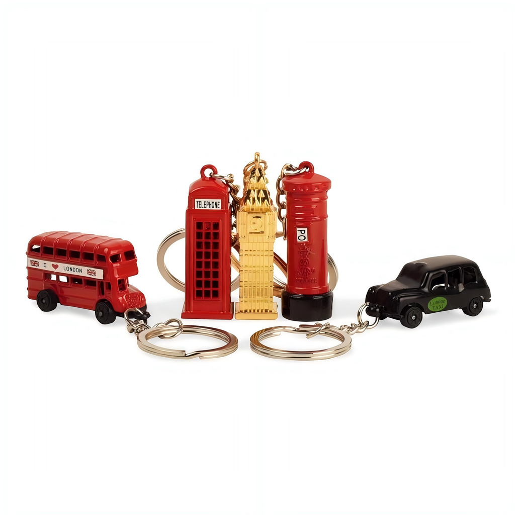 A set of four miniature London-themed keychains on a plain white background: a red double-decker bus, a red telephone booth, a gold Big Ben tower figure, and a red post box next to a black taxi car.
